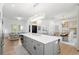 Spacious kitchen island with seating, seamlessly flows into the living and dining areas at 3707 Smoke Hickory Ln, Valrico, FL 33596