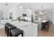 Modern kitchen with a long island, stainless appliances, and breakfast bar seating for casual dining at 3707 Smoke Hickory Ln, Valrico, FL 33596