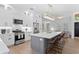 Stylish kitchen with a central island, stainless appliances, and an open layout to the living space at 3707 Smoke Hickory Ln, Valrico, FL 33596