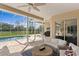 Lovely screened-in lanai with comfortable seating, perfect for outdoor relaxation by the pool at 3707 Smoke Hickory Ln, Valrico, FL 33596