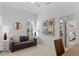 Comfortable living room with a gray sofa, side tables, and artwork, creating a cozy and inviting atmosphere at 3707 Smoke Hickory Ln, Valrico, FL 33596