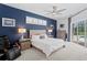 Main bedroom with en-suite, recessed lights, hardwood floors, and sliding glass door access to the outdoors at 3707 Smoke Hickory Ln, Valrico, FL 33596