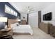Main bedroom with en-suite, recessed lights, carpeted floors, and tv at 3707 Smoke Hickory Ln, Valrico, FL 33596
