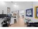 Office space with a built-in desk, and a view into an open concept home design at 3707 Smoke Hickory Ln, Valrico, FL 33596