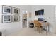 Bright office space with a desk, chair, and artwork creating a productive and inspiring work environment at 3707 Smoke Hickory Ln, Valrico, FL 33596