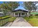 Tennis Club featuring a modern design, well-maintained landscaping, and inviting entrance for tennis enthusiasts at 3707 Smoke Hickory Ln, Valrico, FL 33596