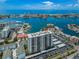 Aerial view of a high rise apartment building offering stunning views of the bay and marina at 400 Island Way # 1606, Clearwater Beach, FL 33767
