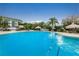 Large community pool with plenty of deck space for lounging and tropical decor at 400 Island Way # 1606, Clearwater Beach, FL 33767