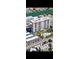 Exterior shot of a high rise condo building with parking and pool area; condo located near the water at 400 Island Way # 1606, Clearwater Beach, FL 33767