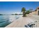 Waterfront home featuring a spacious deck with ample room for seating and enjoying the scenic views at 400 Island Way # 1606, Clearwater Beach, FL 33767