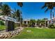 Island West Grill exterior featuring lush landscaping, a fountain, and dining area at 400 Island Way # 1606, Clearwater Beach, FL 33767