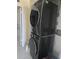 Laundry area features stacked washer and dryer for convenience and space saving at 400 Island Way # 1606, Clearwater Beach, FL 33767