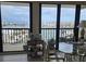 Bright living room features water views through large sliding glass doors opening to the balcony at 400 Island Way # 1606, Clearwater Beach, FL 33767