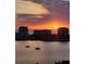 Beautiful sunset over the water highlighting buildings and sailboats at 400 Island Way # 1606, Clearwater Beach, FL 33767