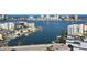 Beautiful water view from the condo featuring boats, houses, and neighborhood buildings at 400 Island Way # 1606, Clearwater Beach, FL 33767