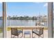 Enjoy waterfront views from this charming patio with ample seating at 4103 Gulf Blvd # 106, St Pete Beach, FL 33706