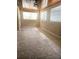 Bright bedroom with tile flooring, multiple windows, and wood-paneled ceiling creating a cozy space at 4111 W La Salle St, Tampa, FL 33607