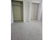 Bedroom closets featuring double doors, neutral walls, and tiled floors at 4111 W La Salle St, Tampa, FL 33607