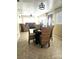 Bright dining area with tile flooring, a view of the living room and natural light throughout at 4111 W La Salle St, Tampa, FL 33607