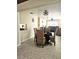 Open-concept dining area with views into the living spaces, with tile flooring and modern lighting fixtures at 4111 W La Salle St, Tampa, FL 33607
