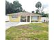 Charming single-story home with a well-maintained lawn and inviting front porch seating at 4111 W La Salle St, Tampa, FL 33607