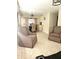 Cozy living room with tile floors and neutral walls, leading to a dining area, perfect for gatherings at 4111 W La Salle St, Tampa, FL 33607