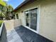 Cozy balcony featuring gray tile flooring and neighborhood view at 4215 E Bay Dr # 1707C, Clearwater, FL 33764