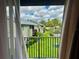Balcony view overlooking a lawn with an apartment complex in the background at 4215 E Bay Dr # 1707C, Clearwater, FL 33764