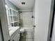 Bathroom features a shower and bathtub combination with white tiling and a storage shelf at 4215 E Bay Dr # 1707C, Clearwater, FL 33764