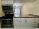 Functional kitchen with an oven, microwave, ample counter space, and storage that will meet your cooking needs at 4215 E Bay Dr # 1707C, Clearwater, FL 33764