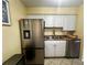 Charming kitchen featuring stainless steel fridge and double basin sink at 4215 E Bay Dr # 1707C, Clearwater, FL 33764