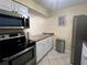 Well-lit kitchen featuring stainless steel appliances and white cabinets at 4215 E Bay Dr # 1707C, Clearwater, FL 33764