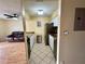 View of the kitchen leading to living area with tiled floors and modern appliances that enhance the cooking experience at 4215 E Bay Dr # 1707C, Clearwater, FL 33764