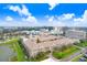 Aerial view of a community building surrounded by foliage with city skyline at 4221 W Spruce St # 1429, Tampa, FL 33607