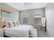 Bright bedroom features neutral decor, large windows, and comfortable seating at 4221 W Spruce St # 1429, Tampa, FL 33607