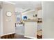 View of the living room and kitchen with neutral walls, stylish furniture, a ceiling fan, and a TV at 4221 W Spruce St # 1429, Tampa, FL 33607