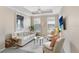 Bright living room with neutral paint, modern furniture, large windows, and recessed lighting at 4221 W Spruce St # 1429, Tampa, FL 33607