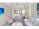 Living room with modern furniture and bar stool seating to the kitchen at 4221 W Spruce St # 1429, Tampa, FL 33607