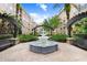 Beautiful water fountain within a community courtyard with seating, landscaping, and architecture with blue sky above at 4221 W Spruce St # 1429, Tampa, FL 33607