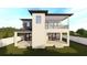 Back elevation features a covered patio, balcony, and manicured lawn, complementing the modern design of the two-story home at 4316 Wallace Cir, Tampa, FL 33611