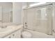 Bright bathroom featuring a shower with glass doors, sink, and a toilet at 502 Arch Ridge Loop, Seffner, FL 33584