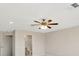 Spacious bedroom features a ceiling fan and an adjacent bathroom at 502 Arch Ridge Loop, Seffner, FL 33584