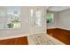 Bright foyer with hardwood floors, and a decorative tile inset at 502 Arch Ridge Loop, Seffner, FL 33584
