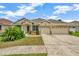 Charming single-story home with a well-manicured lawn and a two-car garage in a sunny location at 502 Arch Ridge Loop, Seffner, FL 33584