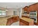 Kitchen featuring granite countertops, stainless steel appliances, and tile floors at 502 Arch Ridge Loop, Seffner, FL 33584