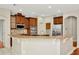 Spacious kitchen with stainless steel appliances, granite countertops, and tile backsplash at 502 Arch Ridge Loop, Seffner, FL 33584