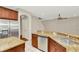 Open kitchen featuring granite countertops, stainless steel appliances, and hardwood floors nearby at 502 Arch Ridge Loop, Seffner, FL 33584