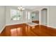 Spacious living room with hardwood floors and large windows at 502 Arch Ridge Loop, Seffner, FL 33584