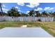 Expansive backyard enclosed by a white fence, offering ample space for outdoor activities and privacy at 6081 22Nd N Ave, St Petersburg, FL 33710