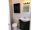 Bathroom features a black vanity and classic fixtures at 6081 22Nd N Ave, St Petersburg, FL 33710